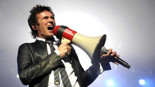 Scott Weiland onstage with a megaphone