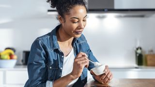 Woman eating yogurt
