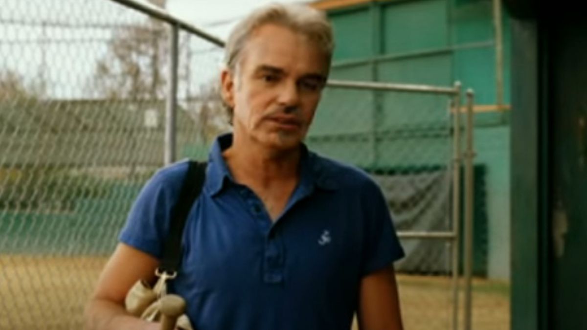 Billy Bob Thornton wearing sunglasses in a baseball dugout