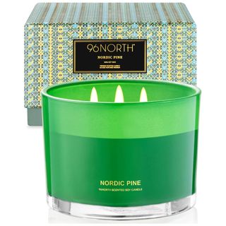 A green 3 wick Nordic Pine candle with patterned box