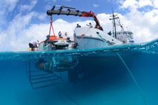 The "Curasub" submarine, a submarine of the Cura&ccedil;ao Sea Aquarium that can descend nearly 1,000 feet undersea, immersed in water by the research vessel Chapman. 