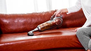 Handheld vacuum used as first step for hoe to clean a leather sofa