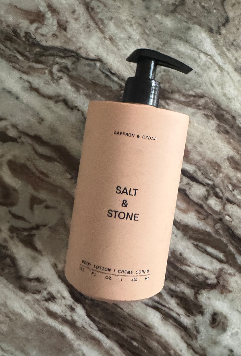 Salt &amp;amp; Stone Saffron &amp;amp; Cedar body lotion on a marble table