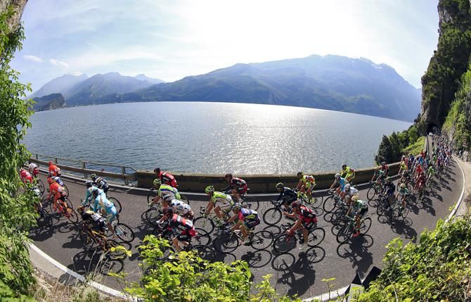The peloton during Stage 2 at the Giro del Trentino passes some beautiful scenery