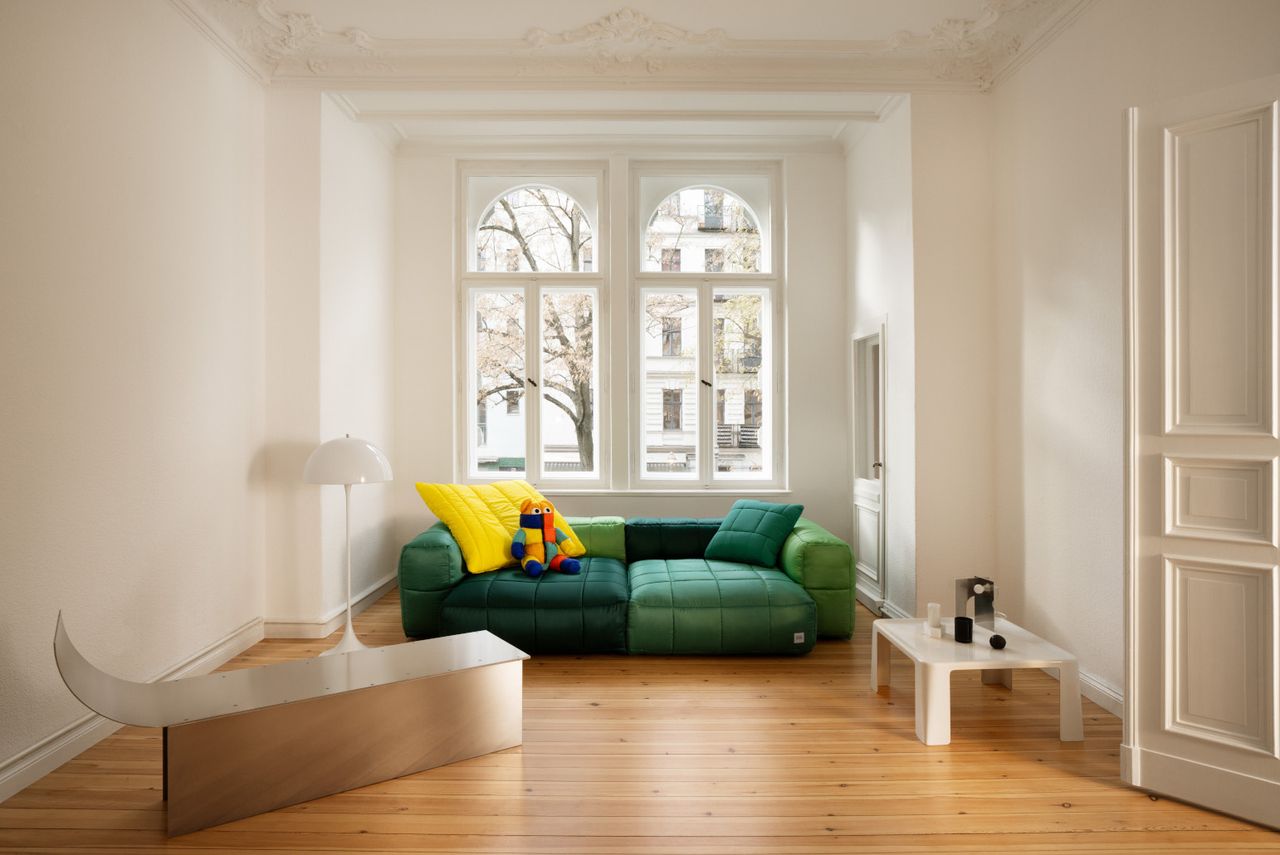 Vetsak x Aspesi Transformation green sofa and bright cushions