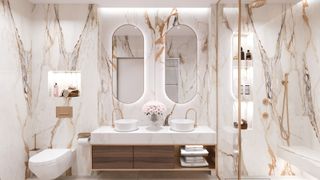 white marble bathroom with ambient light used throughout the room to avoid common bathroom design mistake of bad lighting