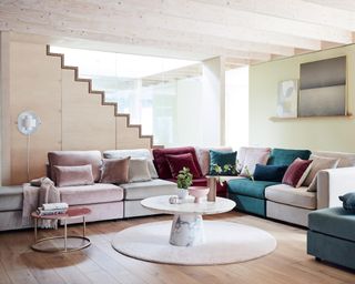 A living room corner idea by DFS with multicolored seating made up of modular seats pushed together