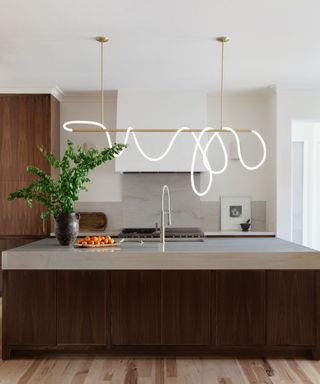 modern kitchen with statement minimalist light