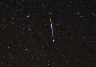 A speck of interplanetary dust burns up in the atmosphere as a meteor.