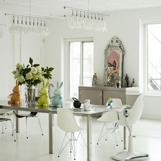 dining room with dining set and white chairs