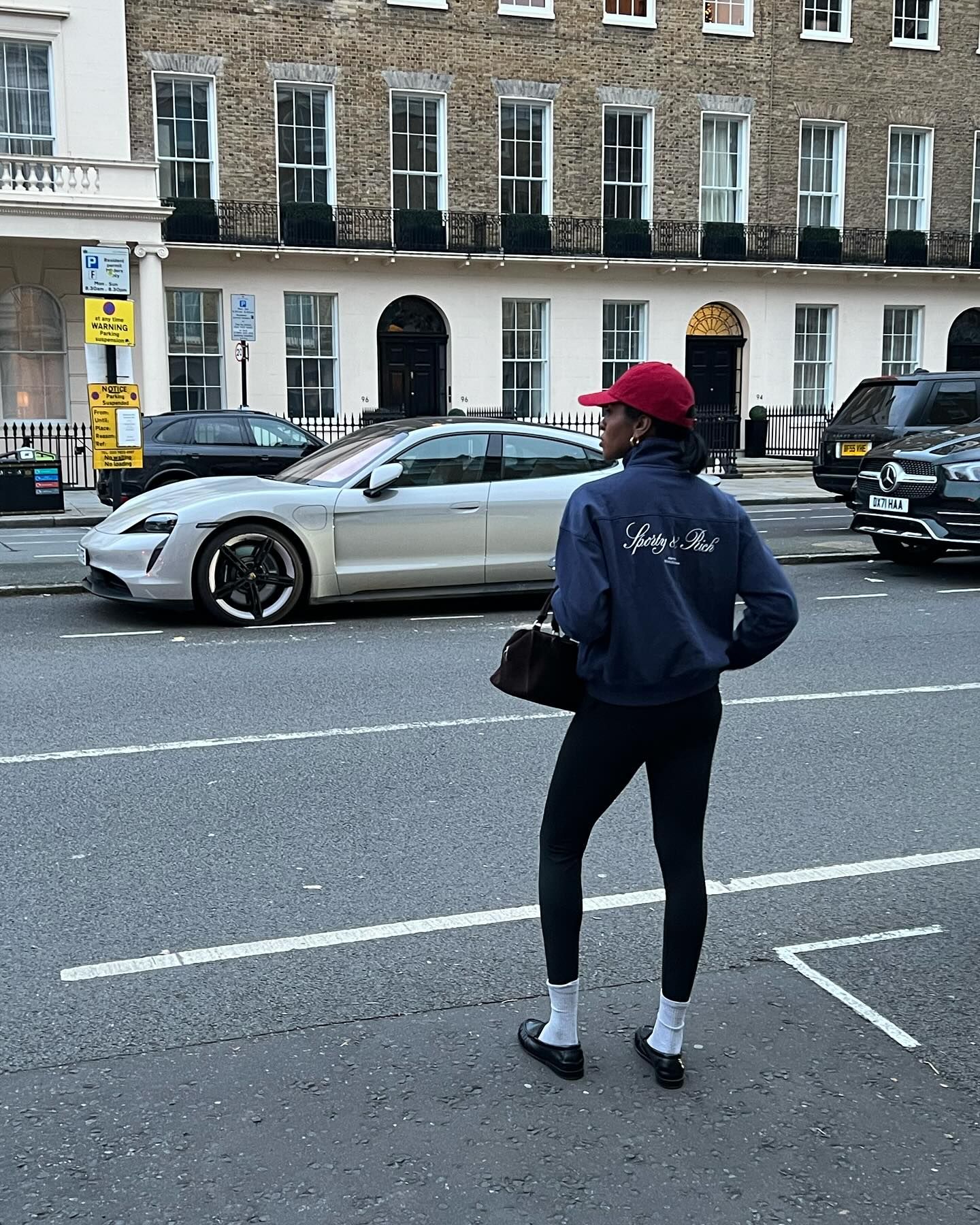 Influencer wears white socks with black shoes.