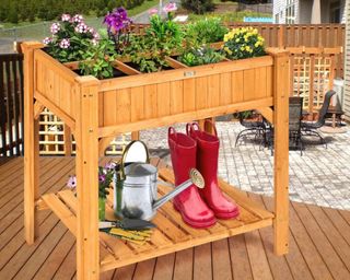 A wood planter with storage on deck