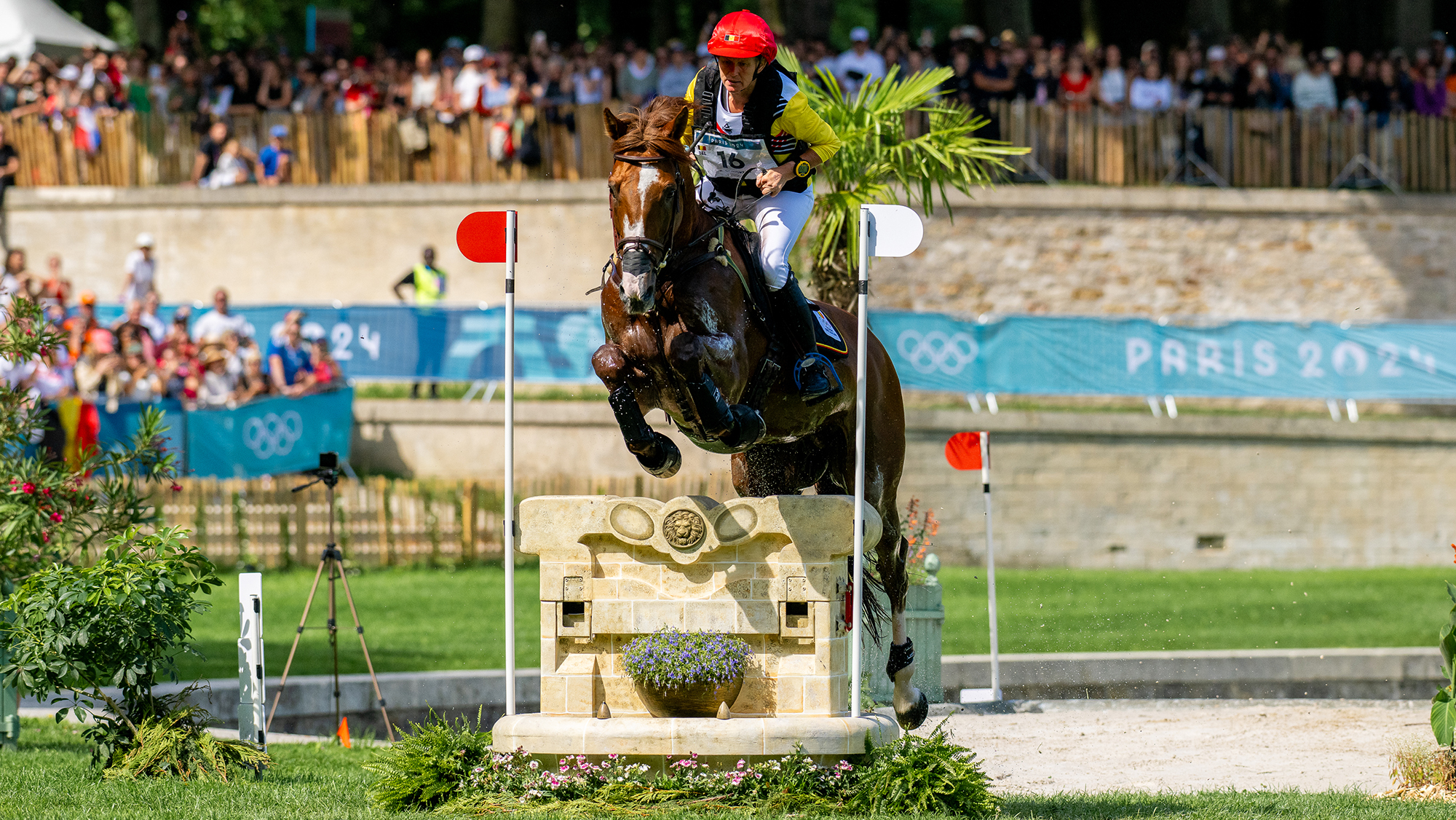 Karin Donckers and Leipheimer Van&rsquo;t Verahof jump a narrow fence on the cross-country course at the Paris Olympics