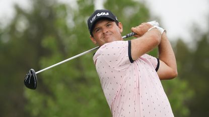 Patrick Reed holds his finish on a drive