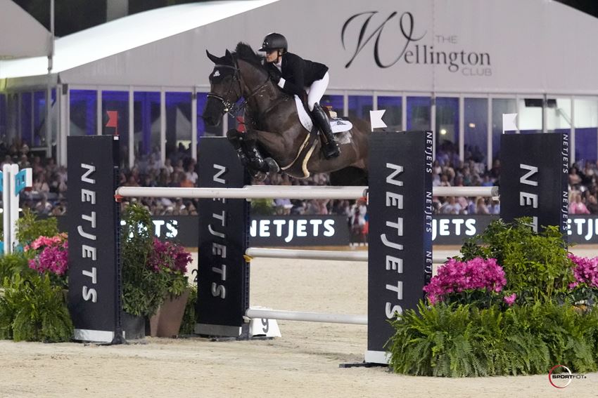 Tiffany Foster and Battlecry jump to victory at the Winter Equestrian Festival