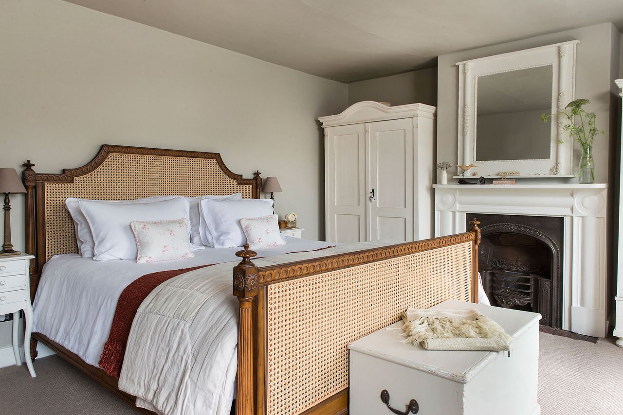 bedroom with fireplace cane bed frame