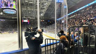 A camera man uses JVC Professional Video solutions at a hockey game.