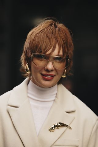 Woman wearing a brooch at New York RTW Fashion Week.