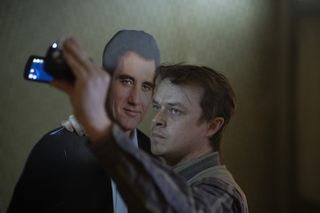 Dane DeHaan stands next to a cardboard cutout of Clive Owen in "Lisey's Story".