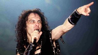 Ronnie James Dio performing onstage in 1985