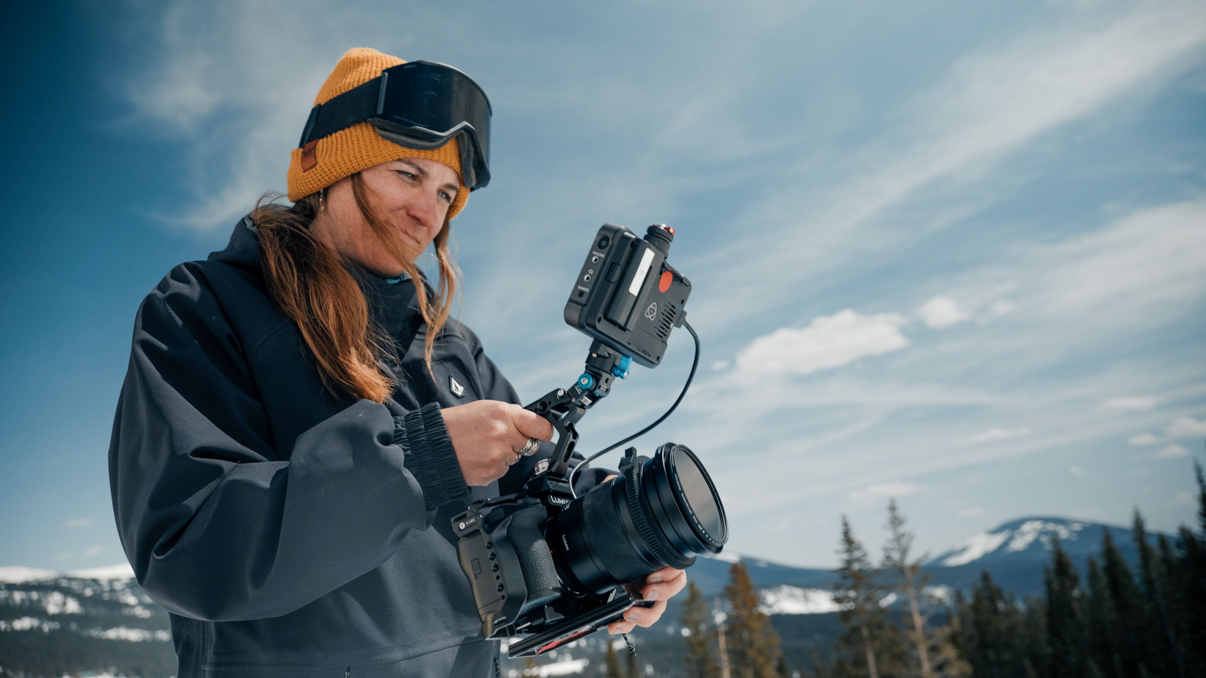Videographer holding a LUMIX S1II camera