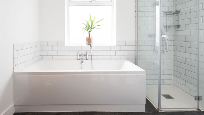 All white bathroom with bath, shower and metro tiles