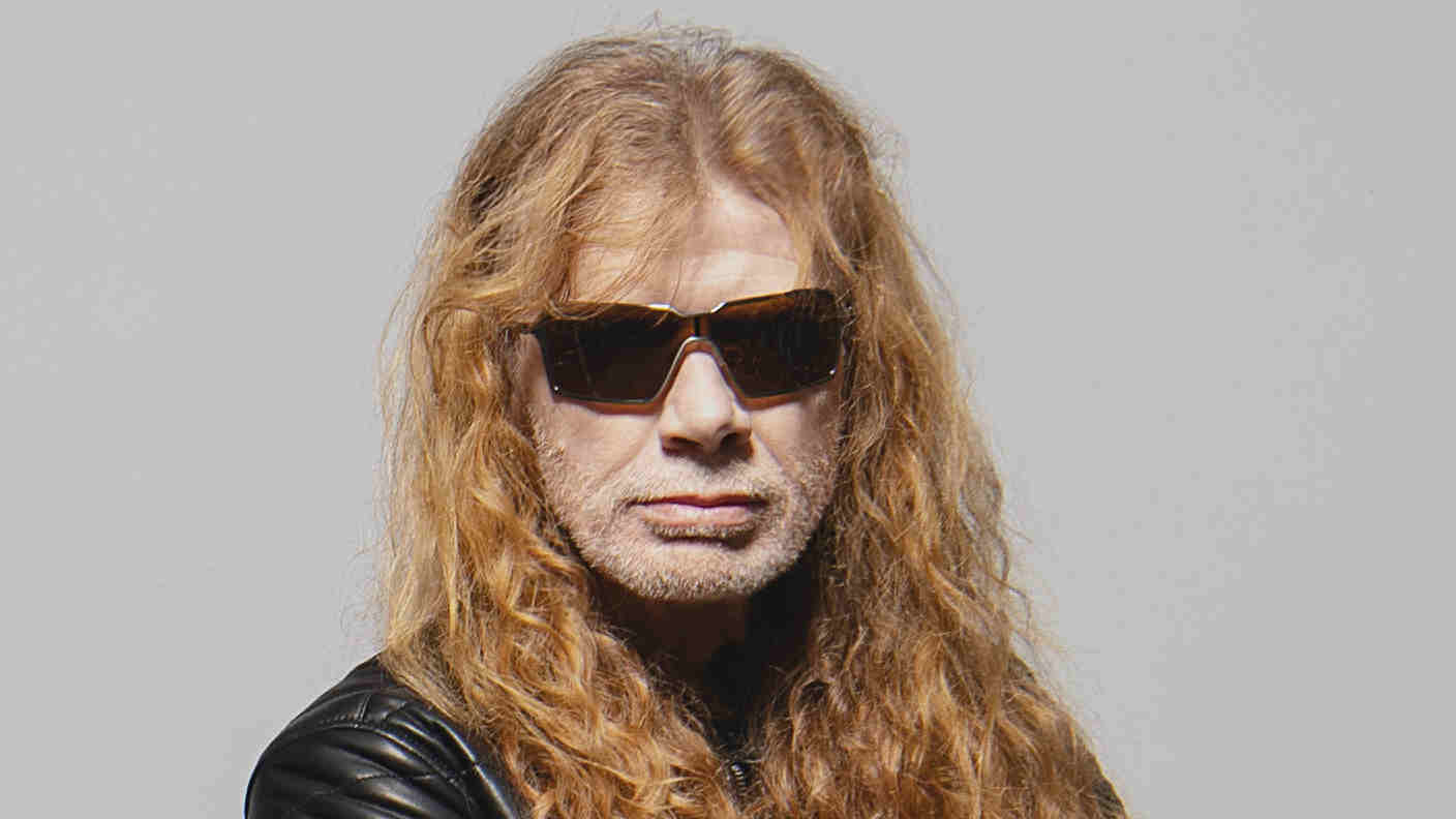 Dave Mustaine posing for a photograph in black sunglasses in 2026