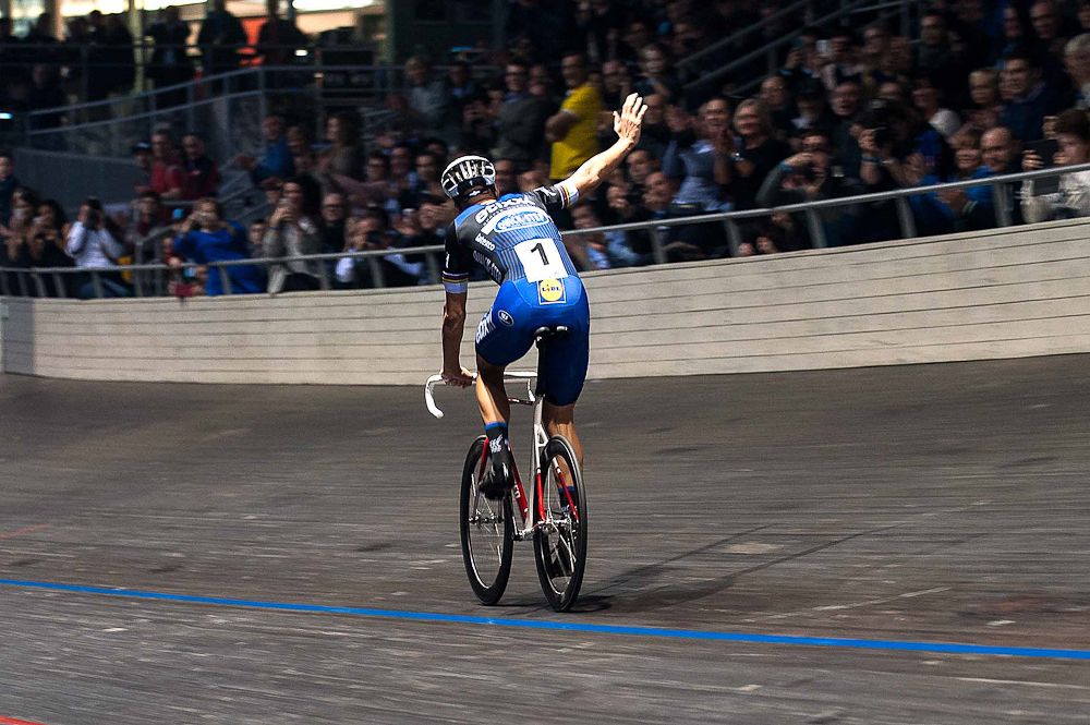 Tom Boonen waves to the crowd at the Etixx-QuickStep team presentation.