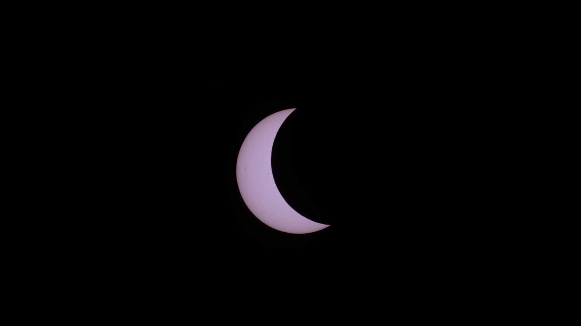 a white crescent on a black background