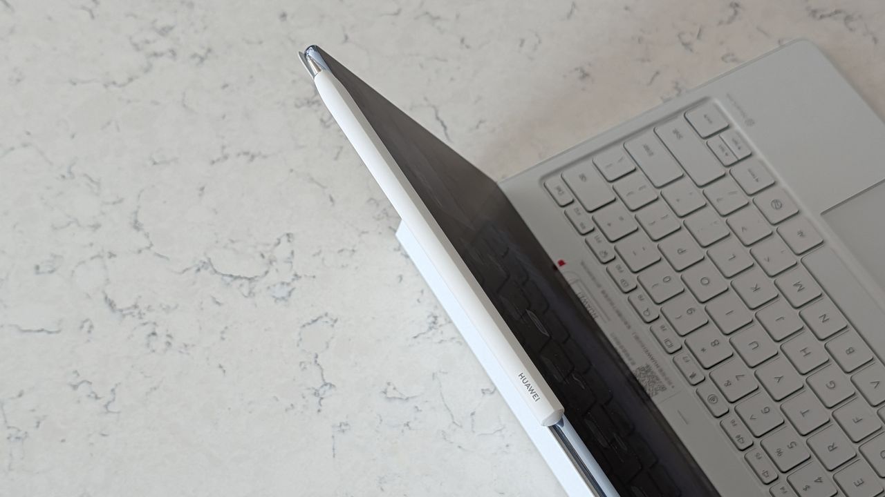 Photos of the Huawei MatePad Pro Max resting on a marble table