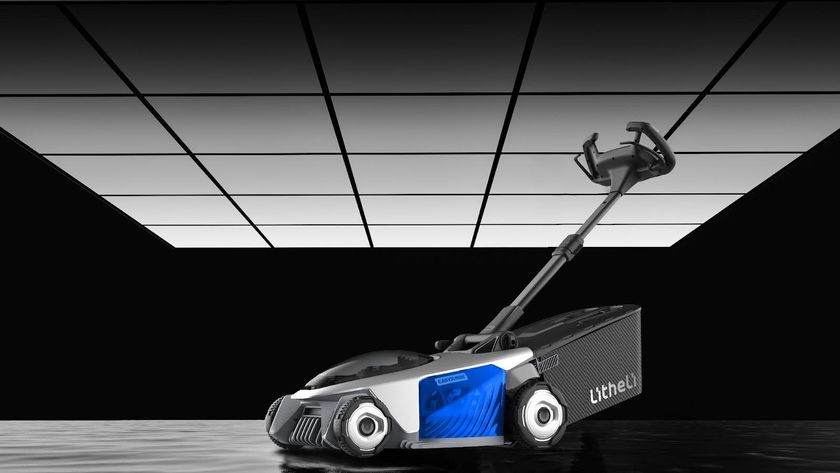 Litheli Easysurge mower on black background with overhead lights