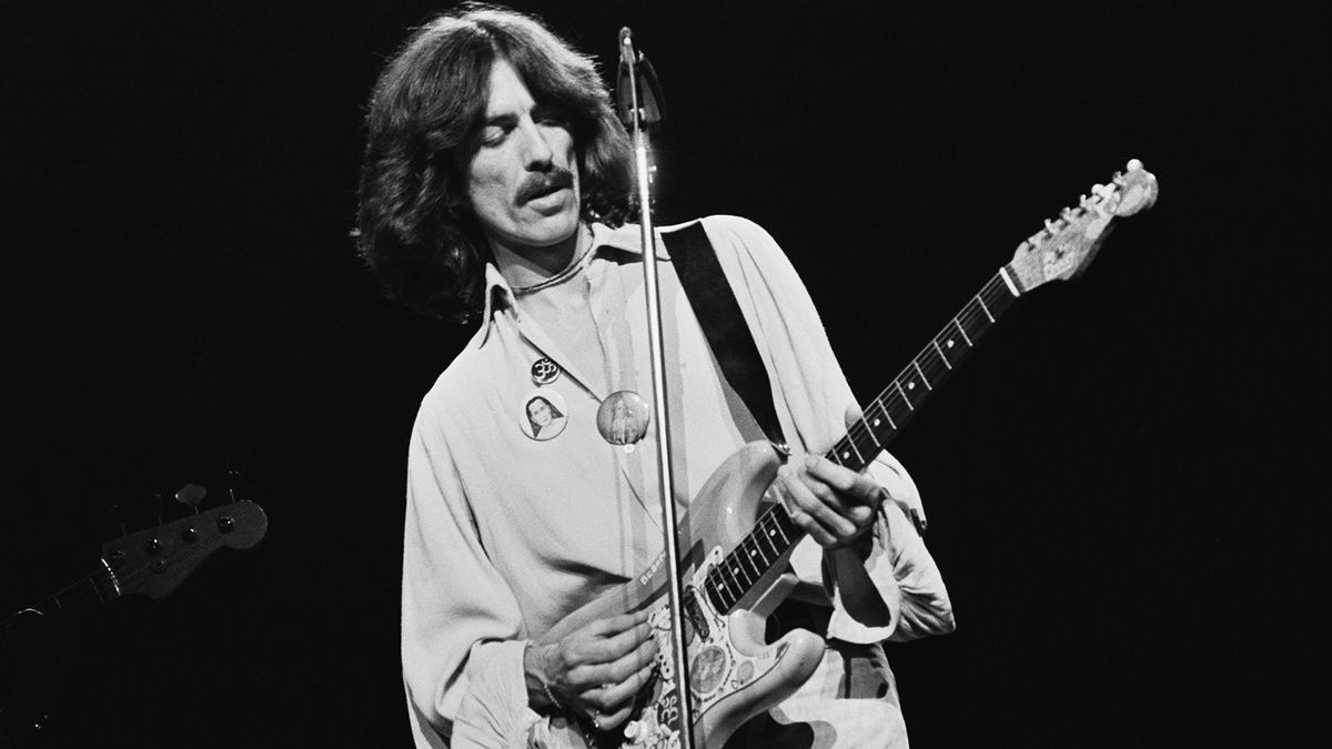 English musician, singer-songwriter, and producer George Harrison (1943 - 2001) performing on stage playing his &#039;Rocky&#039; Sonic Blue Fender Stratocaster during his &#039;George Harrison and Ravi Shankar&#039;s 1974 North American tour&#039; also known as the &#039;Dark Horse Tour&#039; in North America, 1974. 