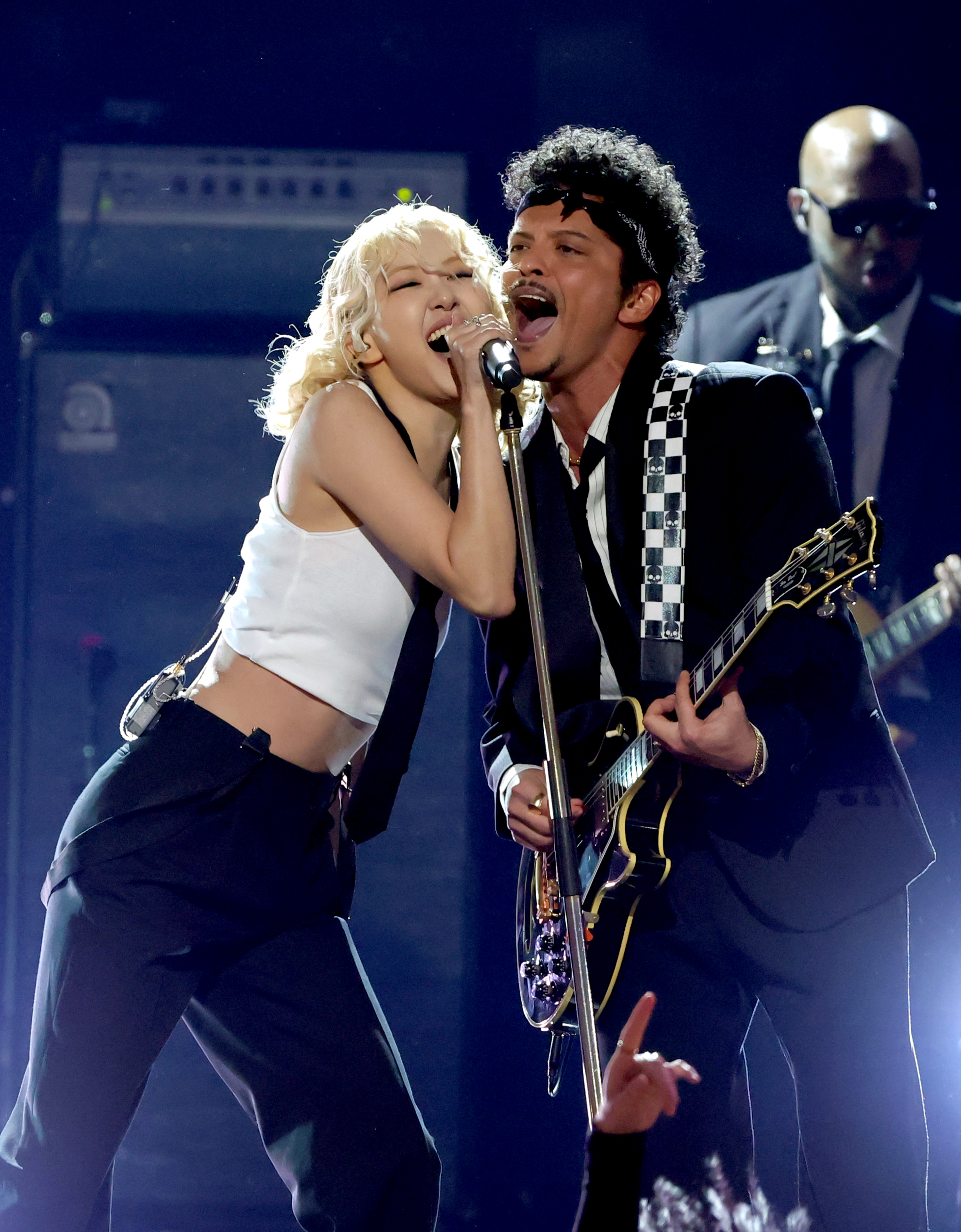 LOS ANGELES, CALIFORNIA - FEBRUARY 01: (L-R) Ros&amp;eacute; and Bruno Mars perform onstage during the 68th GRAMMY Awards at Crypto.com Arena on February 01, 2026 in Los Angeles, California. (Photo by Kevin Winter/Getty Images for The Recording Academy)