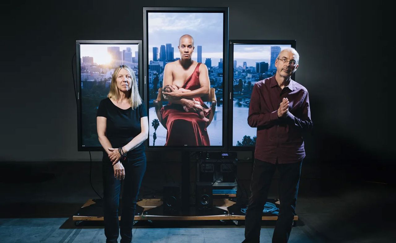 Bill Viola and his partner Kira Perov in 2016 at their studio in Signal Hill, California, with his work, Mary, 2016 – a colour, high-definition video triptych 