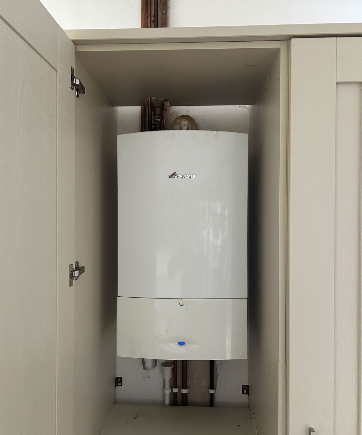 boiler fitted inside a kitchen cupboard