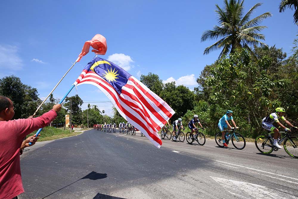 The Malasian flag flies over the race