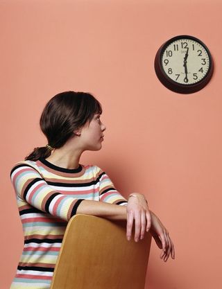 Person looking at a clock