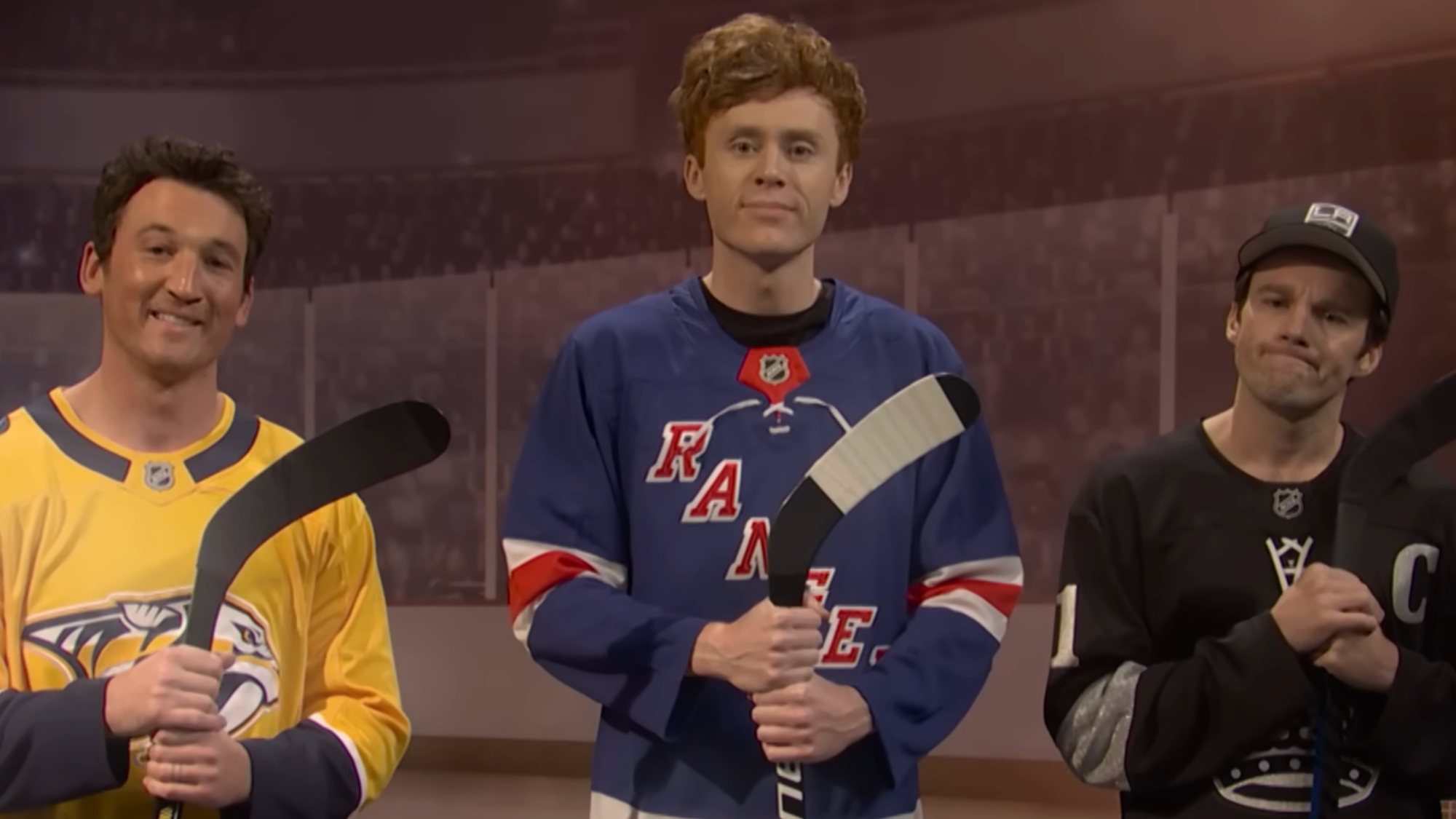 Miles Teller, Tommy Brennan and Ben Marshall read a PSA while dressed in hockey sweaters.