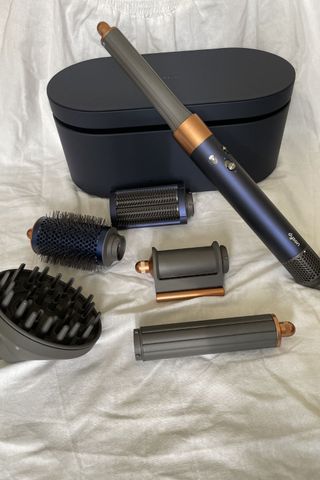 the dyson airwrap with all attachments and storage box