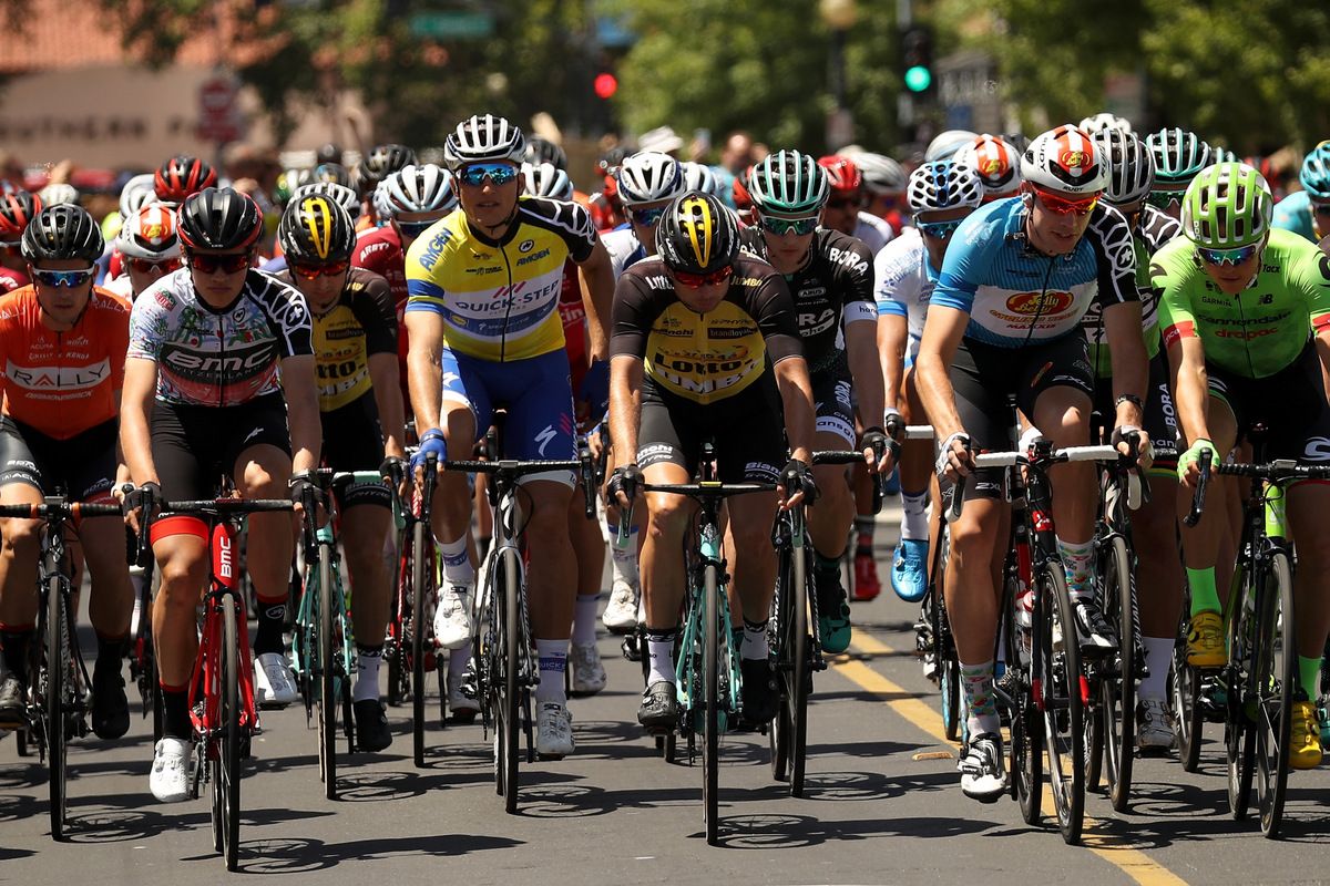 The jersey leaders lead the peloton as they roll out