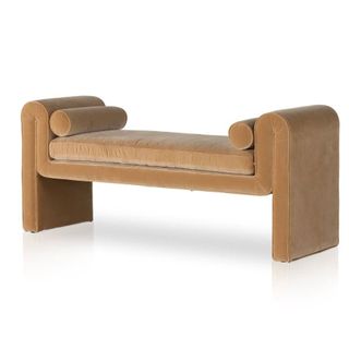An upholstered bench in camel color