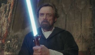 Luke Skywalker with lightsaber in Star Wars: The Last Jedi