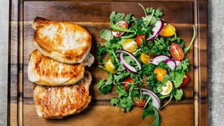 pork chops and salad on a paleo diet