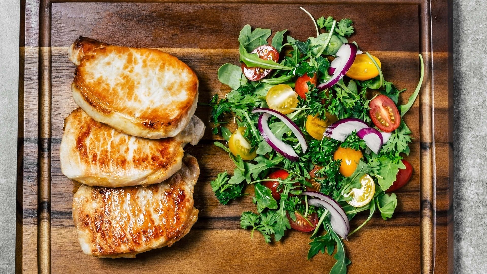 Paleo diet pork chops and salad