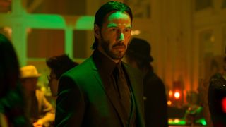 Keanu Reeves stands in a nightclub in John Wick: Chapter 2