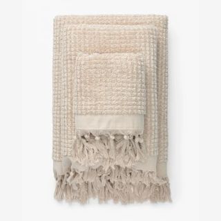 stack of neutral bath towels