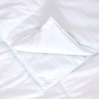 Marks & Spencers white duvet with the corner folded back