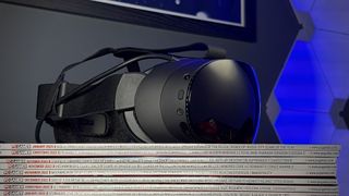The Steam Frame on a stack of PC Gamer magazines.