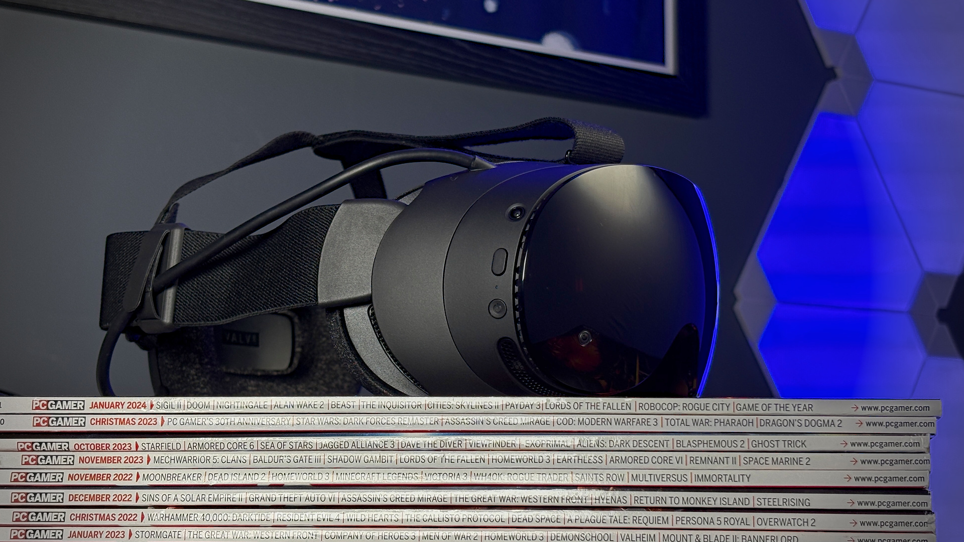 The Steam Frame on a stack of PC Gamer magazines.