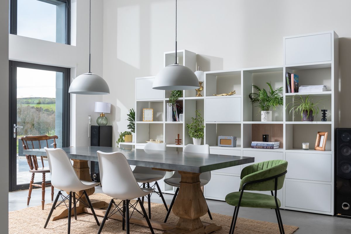 vaulted ceiling dining room with open shelving